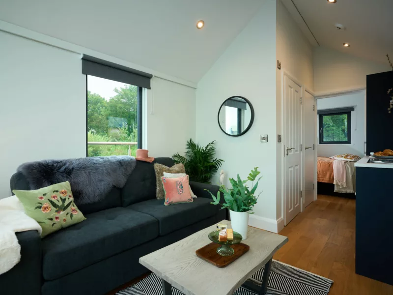 Interior living / kitchen area of C250 houseboat looking from the front to the back towards the bedroom