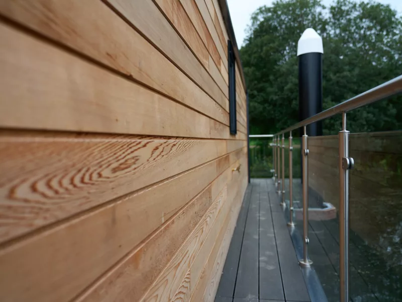 Close up of the cedar cladding on the Ballyronan C250 houseboat and side balcony